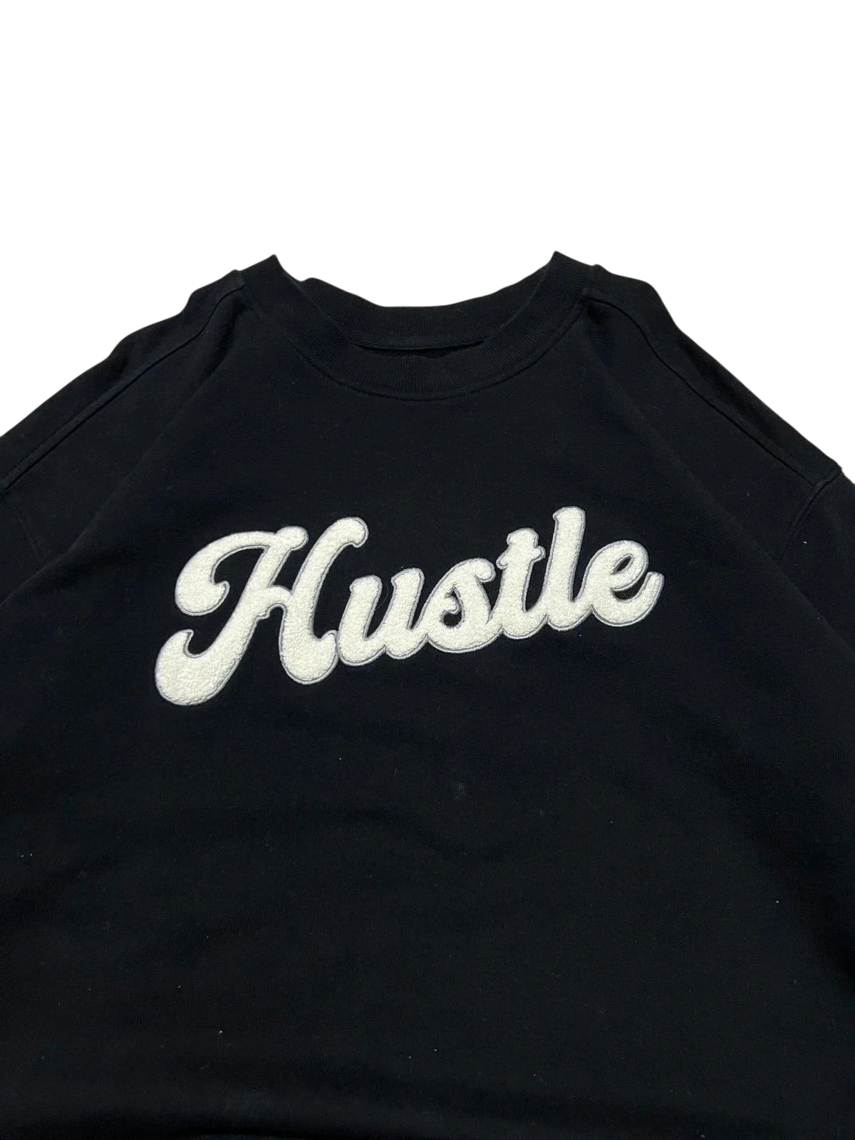 Premier Vintage black crewneck sweatshirt with white embroidered 'Hustle' lettering. Relaxed fit, long sleeves, crew neck.