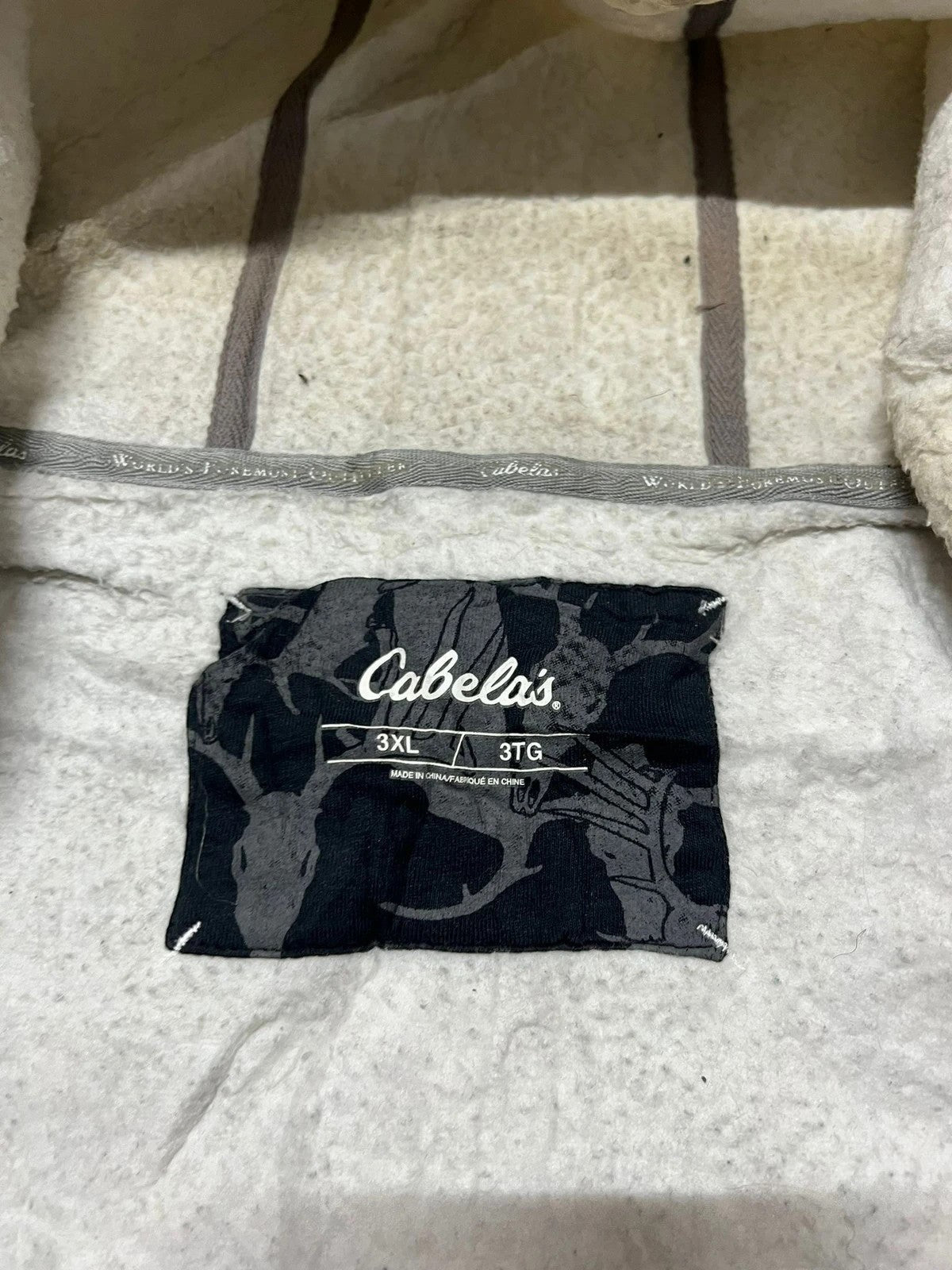 Premier Vintage Cabela's camouflage full zip hoodie with fleece lining and attached hood. Woodland pattern in green, brown, and white.