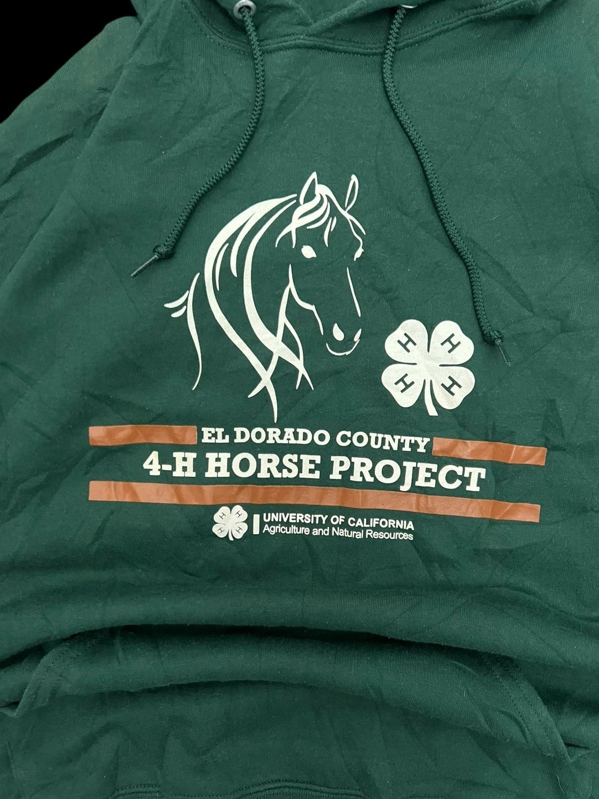 Premier Vintage green hoodie with El Dorado County 4-H Horse Project graphic and University of California logo. Features a horse outline and 4-H emblems.