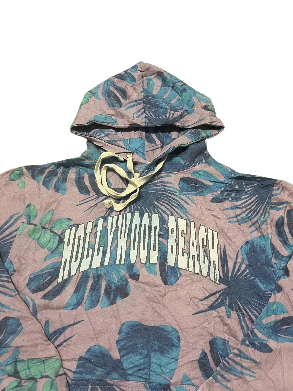 Premier Vintage Hollywood Beach tropical print hoodie with palm leaves in pink, blue, and green. Features drawstring hood.