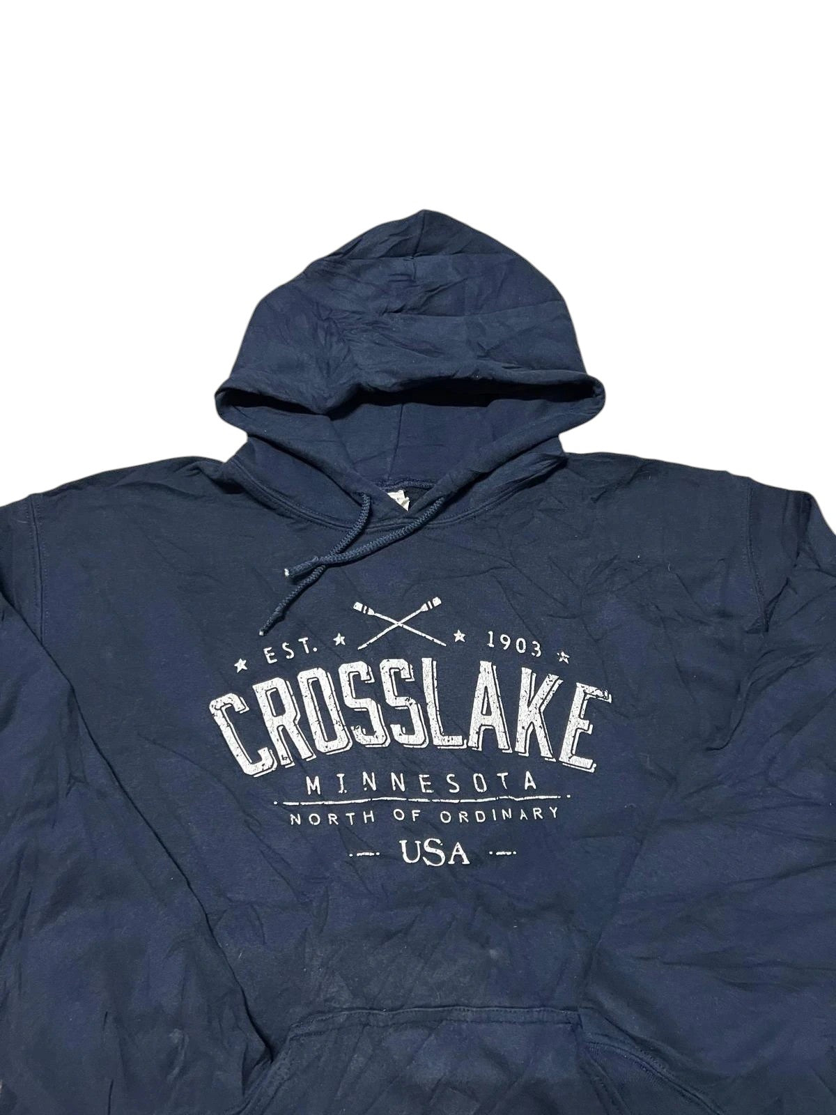 Premier Vintage navy blue hooded sweatshirt with "CROSSLAKE MINNESOTA EST. 1903 NORTH OF ORDINARY USA" graphic. Features drawstring hood and kangaroo pocket.