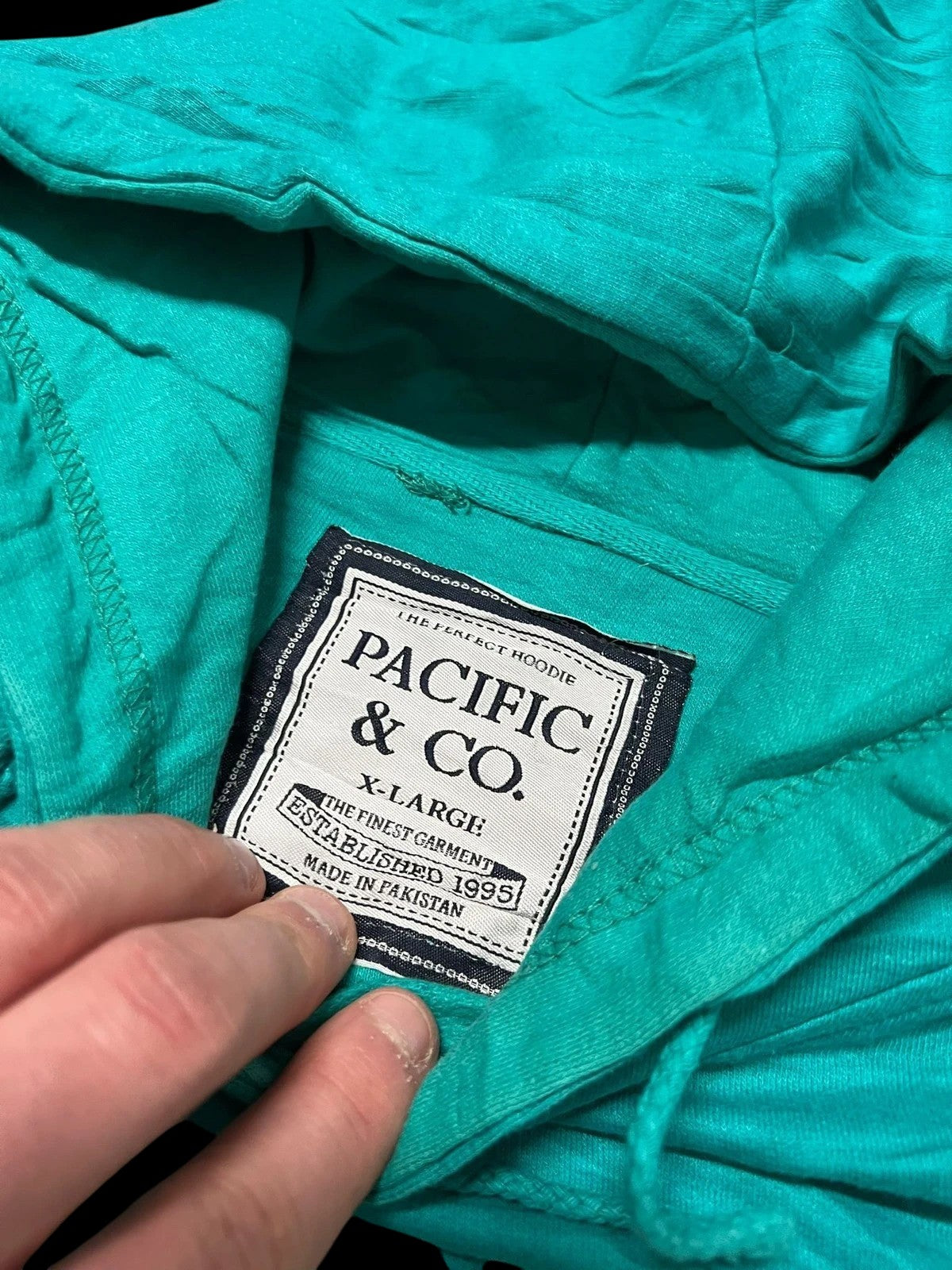 Premier Vintage teal graphic hoodie with Key West Florida text. Pullover style with hood and drawstrings.