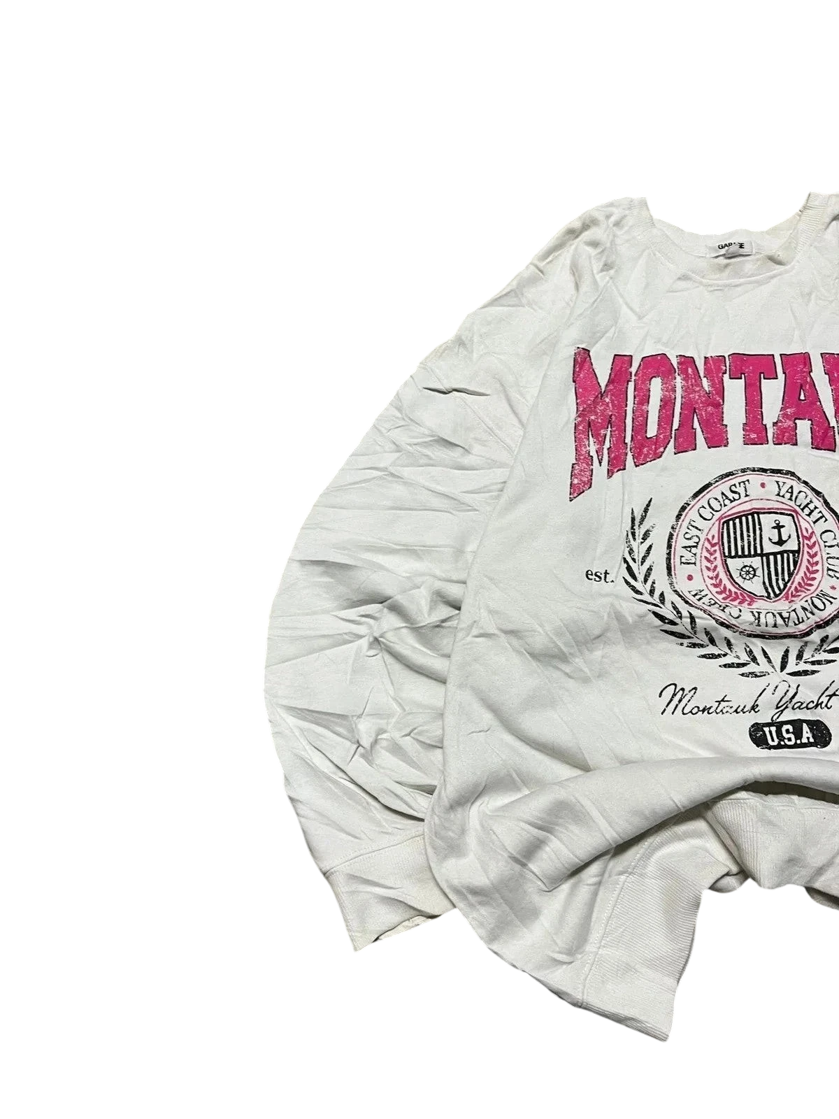 Premier Vintage white crewneck sweatshirt with bold pink "MONTAUK" graphic and yacht club crest. Long sleeves, relaxed fit.